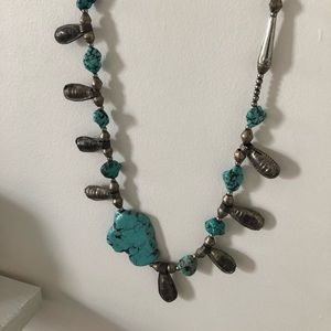 Turquoise Rock and Metal attached to real leather